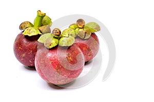 Three mangosteens on a white background