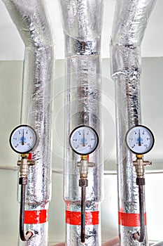 Three manometer on pipes Heating system in basement apartment bu
