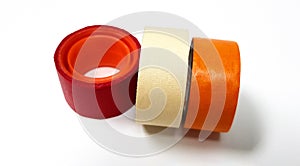 Three masking tapes roll red, white, and orange isolated on white background