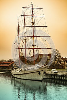 Three-masted sailing schooner moored at the pier