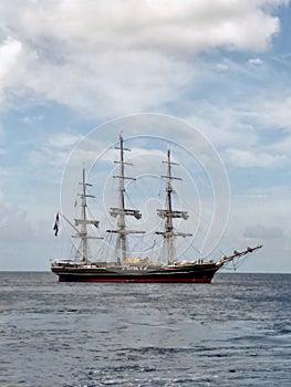 A three-masted schooner at anchor in the windward islands