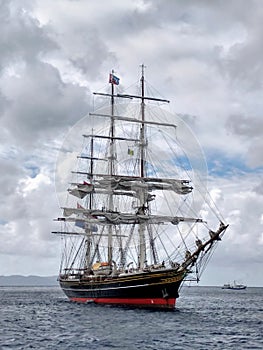 A three-masted schooner at anchor in the windward islands