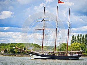 Three masted schooner Oosterschelde under sails on the Seine river for Armada exhibition in France. Cross processed