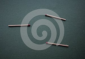 A three matches on a green background