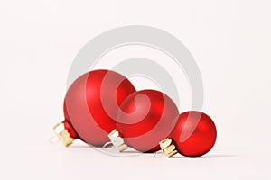 Three matt red christmas balls in a row photo