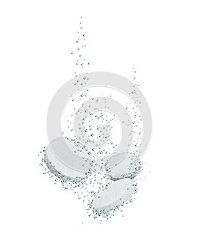 Three medical pills dissolves in water close-up on a white background