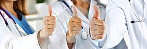 Three medicine doctor hands showing OK or approval sign