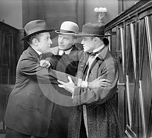Three men arguing with each other photo