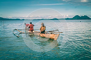 Three men in boat