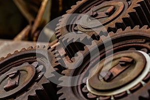 Three meshing gears on the machine. Old rusty industrial mechanism. background