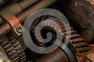 Three meshing gears on the machine. Old rusty industrial mechanism. background