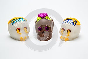 Three Mexican Calaverita de azucar Candy Skull and Calaverita de Chocolate, photo