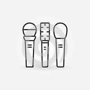 Three microphones vector linear icon or sign