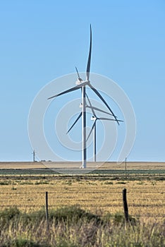 Three mills in a wind farm on the plain