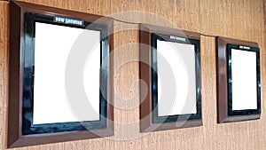 Three Mock up poster frames on Cinema wall