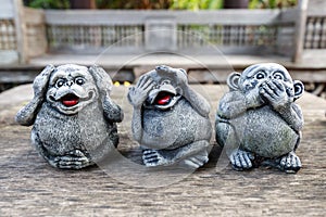 Three monkey statues