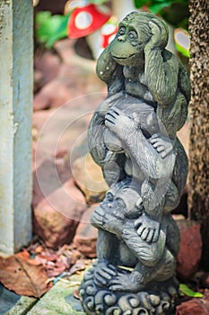 Three monkey dolls are molded using hand action close ears,eyes