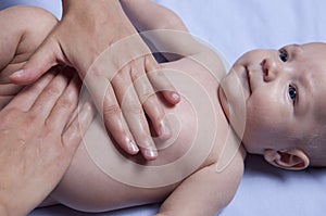 Three month baby boy abdomen massage