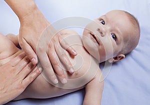 Three month baby boy abdomen massage