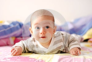 Three months old baby girl smiling