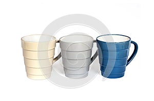 Three mugs isolated on white background