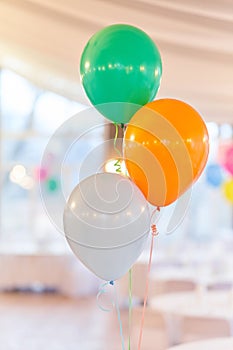 Three multi-colored balloons on holiday. Close-up balloons at an event