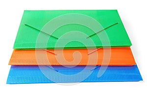 Three multi-colored folders isolated with clipping path