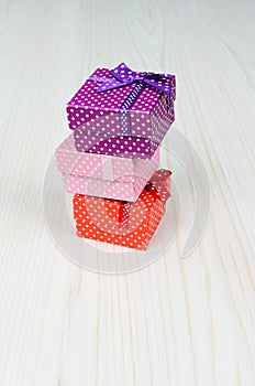 Three multi-colored gift box