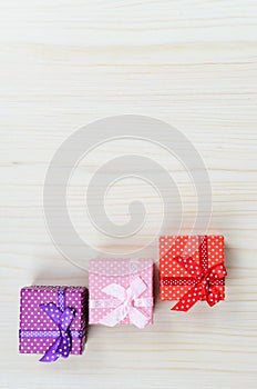 Three multi-colored gift box