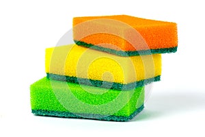 Three multi-colored sponges for washing dishes on white background