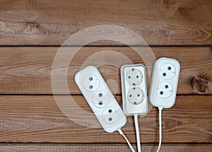 Three multi outlet extension cords on