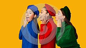 Three Multiethnic Gossip Girls Whispering Secrets Over Yellow Background, Panorama