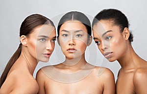 Three Naked Women Models Standing Shirtless Posing In Studio