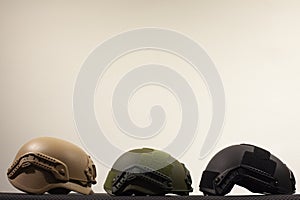 Three nato military helmets on white background