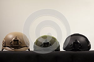 Three nato military helmets on white background