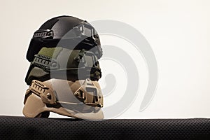 Three nato military helmets on white background