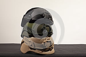 Three nato military helmets on white background