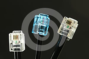 Three network cables with connector on black