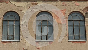 Three old arched windows of building