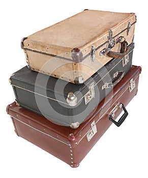 Three old dirty dusty suitcases. Isolated.
