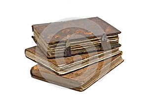 Three Old frayed books isolated over white