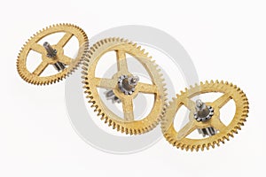 Three old golden cogwheels