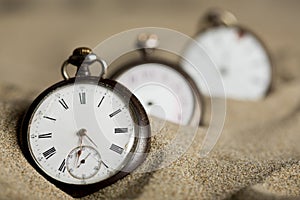 Three old pocket watches photo