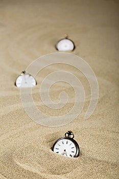 Three old pocket watches, vertical format photo