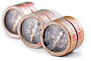 Three old rusty gauge