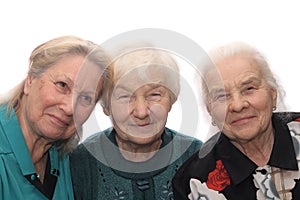 Three old women smiling