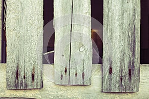Three old wood boards with rusty nails