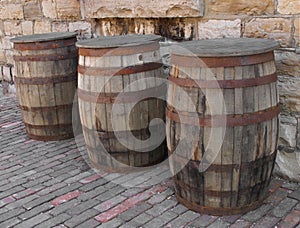 Three old wooden barrels.