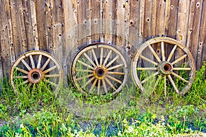 Three Old Wooden Wagon Wheels