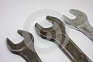 Three old working wrenches on a white background. Work Tool mechanic. Close up